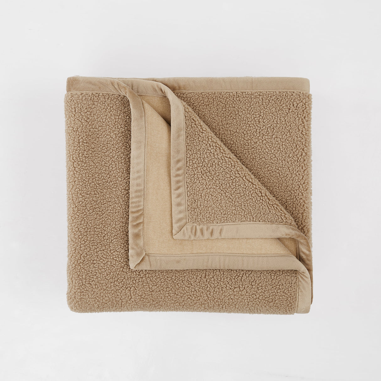 Folded beige towel on a white background