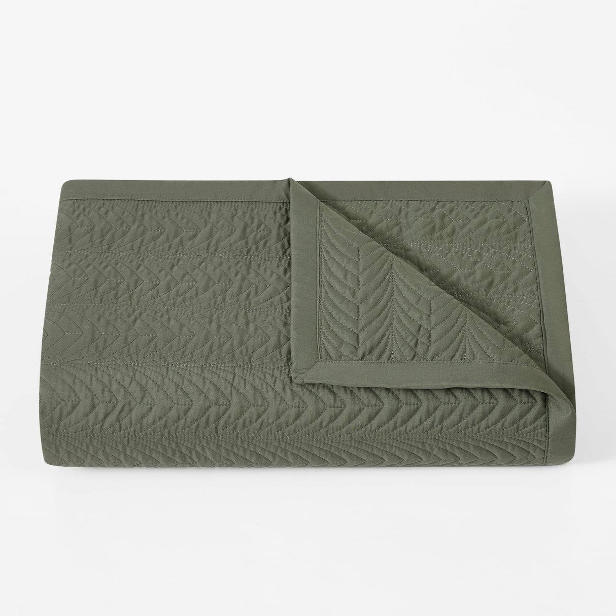 Green textured blanket on a white background