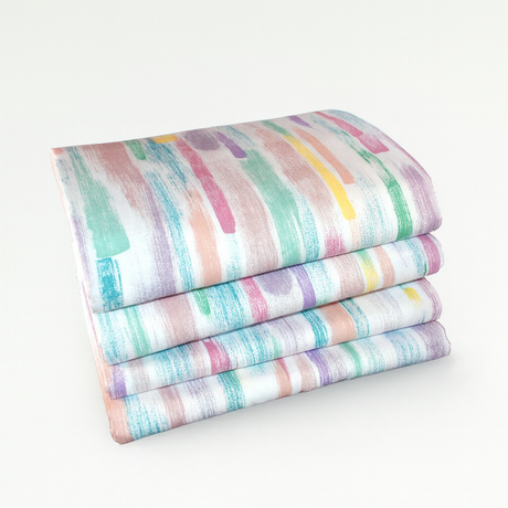 Stack of colorful striped fabric on a white background