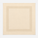 Pictured: Square beige napkin with a satin band acting as a border in the middle. This napkin is laid out against a white background.