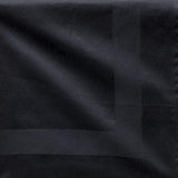 Pictured: Square black napkin with a satin band acting as a border in the middle. 