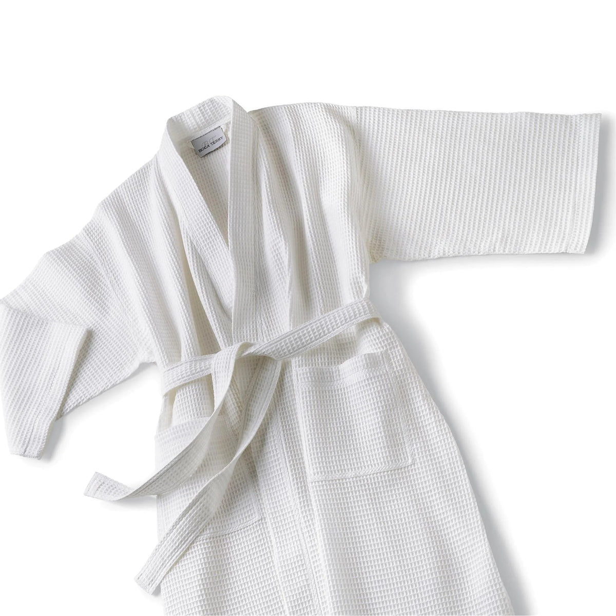 Pictured: Boca Terry white Kimono Robe with waffle texture laid out against a white background.