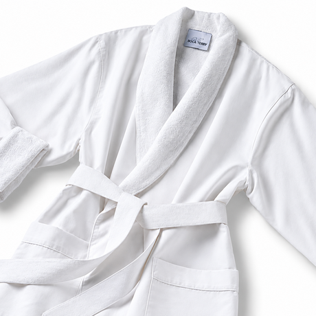 Pictured: White spa robe against a white background. This robe is the Microfiber Classic Shawl Collar Bathrobe. The inside of the robe and the collar are a fluffier material for maximum comfort.