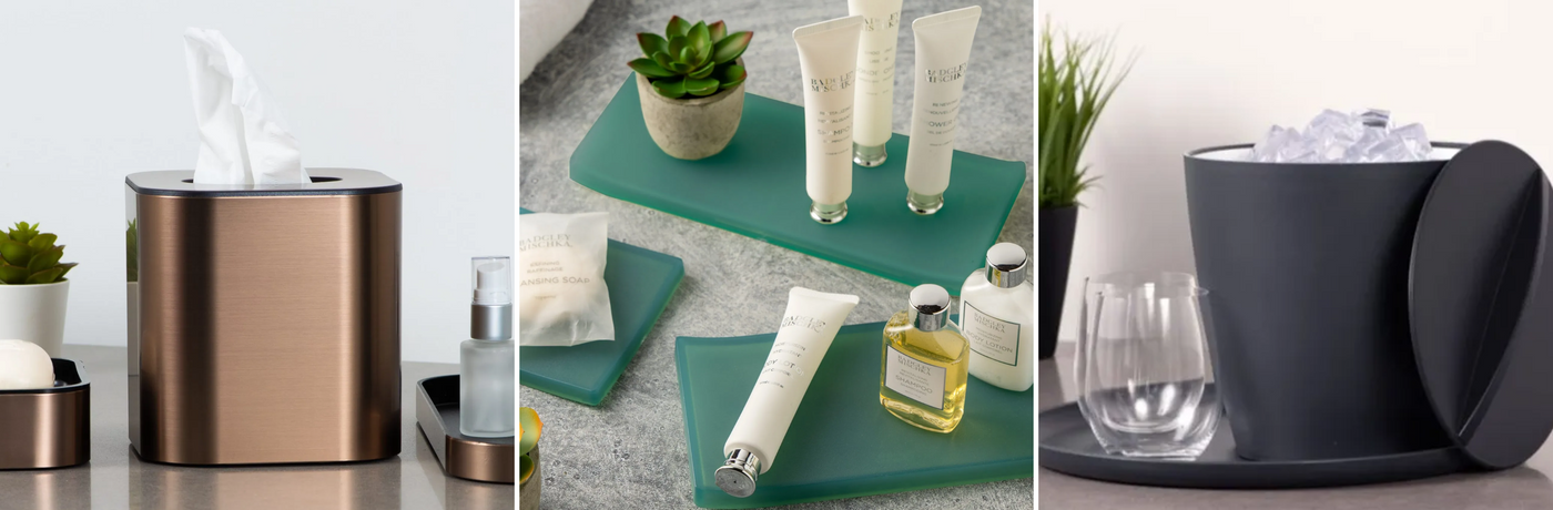 Collection of bathroom products including a tissue holder, bottles, and a plant on a teal shelf.