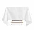 Pictured: Eye level front shot of the white Dynasty Tablecloth draped over a table against a white background.
