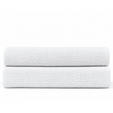 Pictured: The white Healthcare Cotton Thermal Blanket neatly folded against a white background.