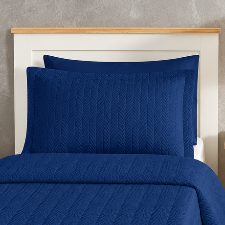 Pictured: Close-up of the Flourish Quilt Pillow Sham in the shade Sail Blue.