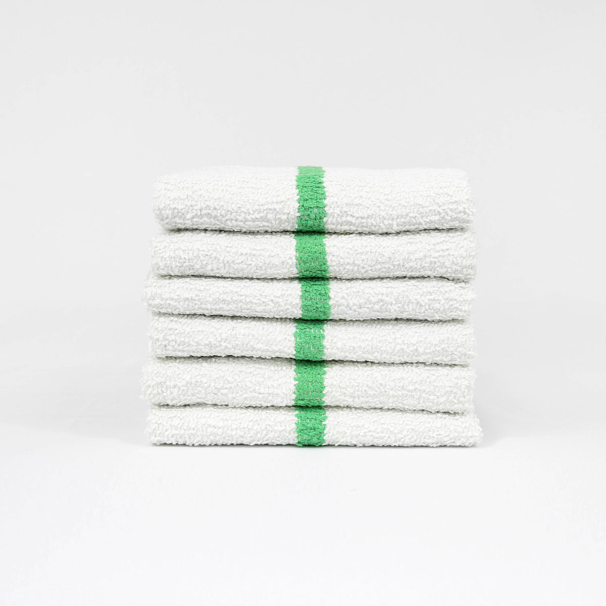 Pictured: Six white bar mops with a green center stripe neatly folded and stacked against a white background.