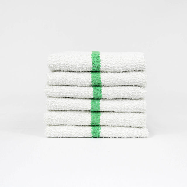 Pictured: Six white bar mops with a green center stripe neatly folded and stacked against a white background.