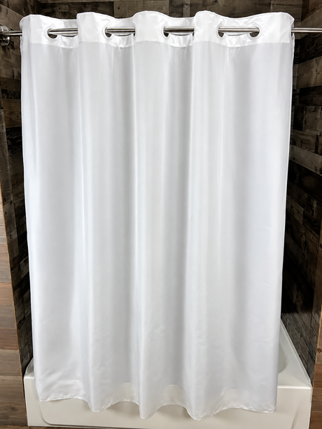 Pictured: The white nylon Hang2It Hotel Shower Curtain hanging on a silver rod in front of a bathtub.