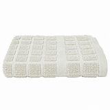 Pictured: Neatly folded Martex dishcloth against a white background. The washcloth pictured is Solid Khaki