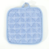 Pictured: Closeup of the Martex pot holder against a white background. This pot holder is in the shade Solid Blue.