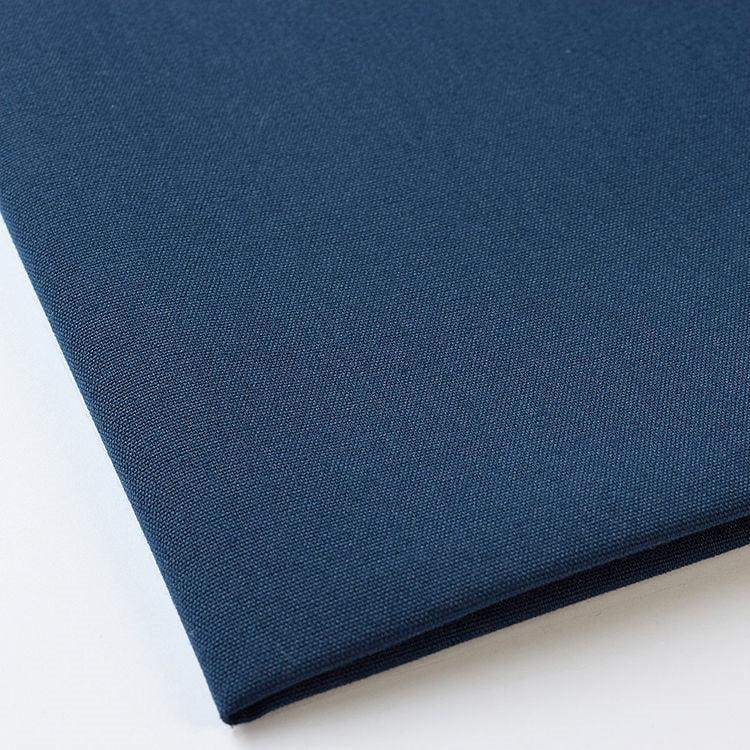 Pictured: Close up of the Premier Napkin neatly folded in the shade Flag Blue against a white background.