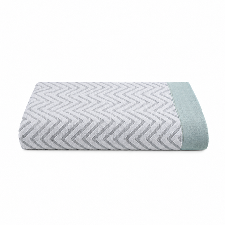 Pictured: Folded Fibertone Chevron Jacquard Pool Towel against a white background. This towel is in the shade "Seafoam".