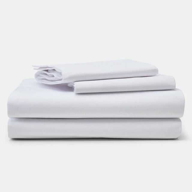 Pictured: Neatly stacked sheet set against a white background. The products featured are the New Era T-180 Sheets.