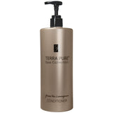 Pictured: Dispenser version of the Terra Pure Green Tea Lemongrass Conditioner against a white background. The product comes in a bronze colored bottle with black writing and a black dispenser.