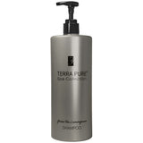 Pictured: Dispenser version of the Terra Pure Green Tea Lemongrass Shampoo against a white background. The product comes in a silver colored bottle with black writing and a black dispenser.