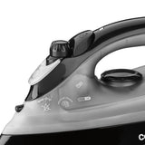 Close-up of a black and silver iron with control knobs on a white background