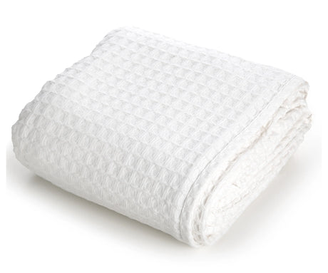 Pictured: Neatly folded waffle woven blanket against a white background. This blanket is in the shade "White".