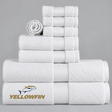 Pictured: White towels with a cam border in the center. The towels are neatly folded and stacked according to size. In the bottom left corner is the YELLOWFIN logo.